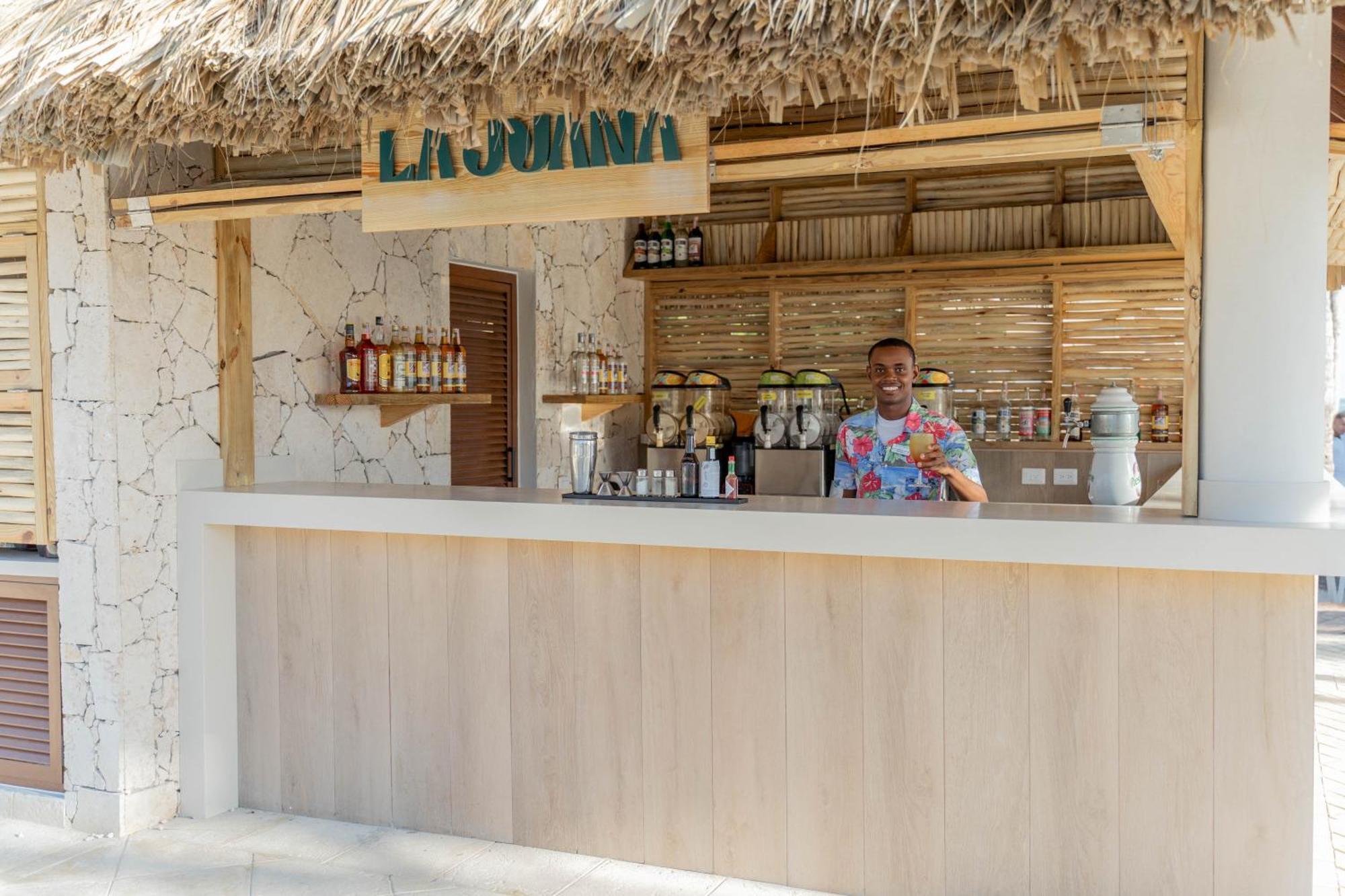 Bahia Principe Grand Punta Cana Exterior foto A bartender at work